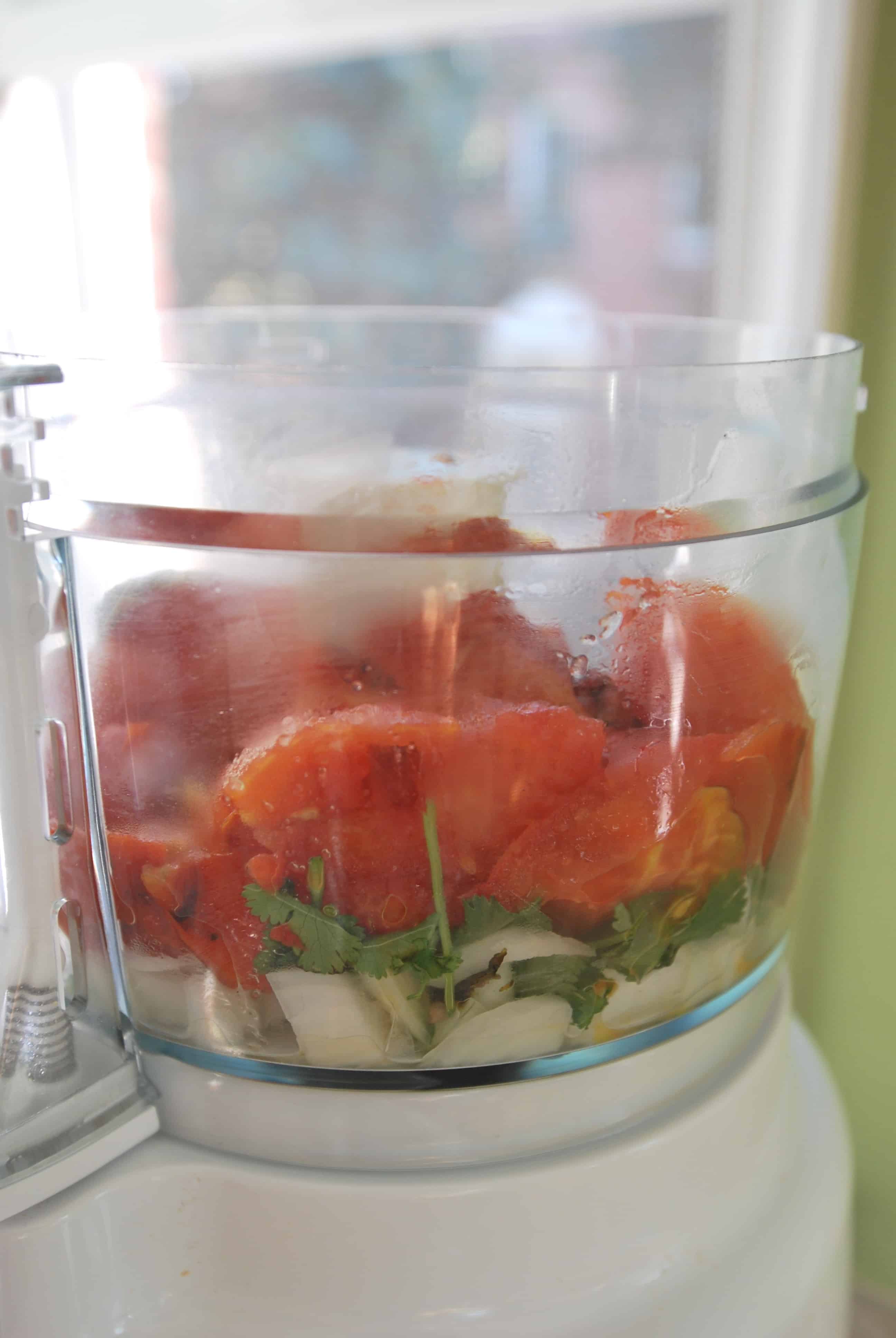 roasted tomato salsa being made in a food processor