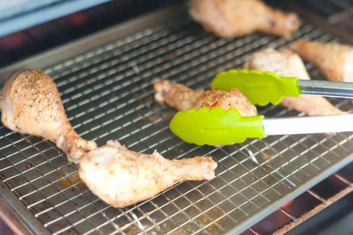 Old Bay Dusted Baked Chicken Drumsticks Recipe Baking chicken drumsticks on a wire rack