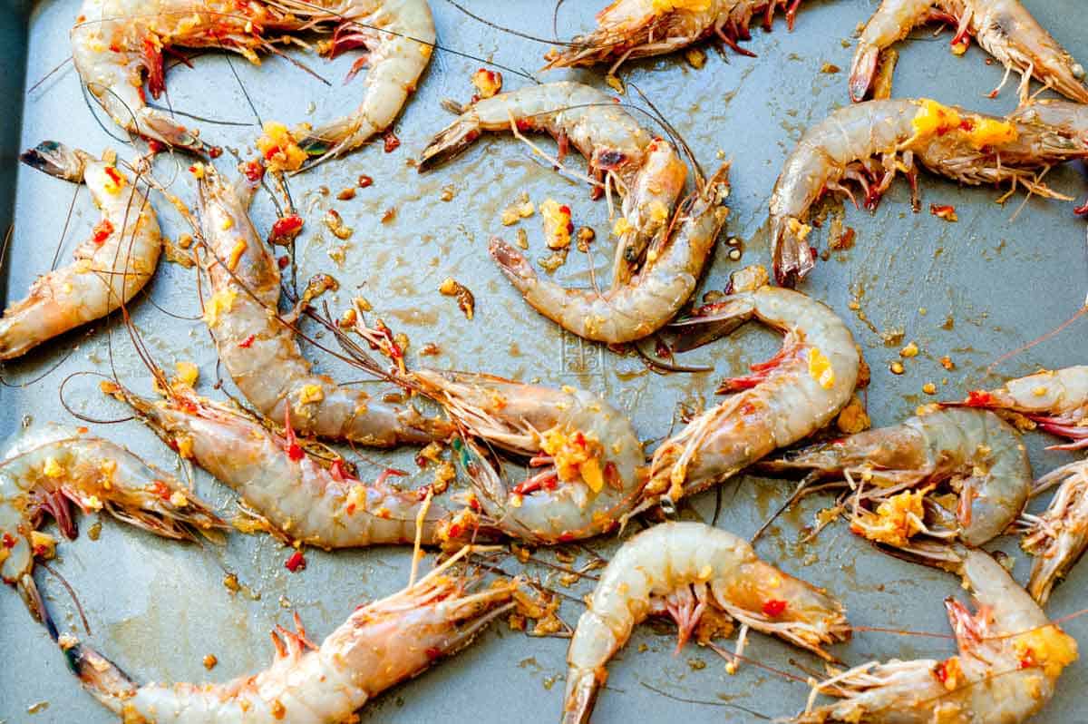 Shrimp on baking sheet ready to bake