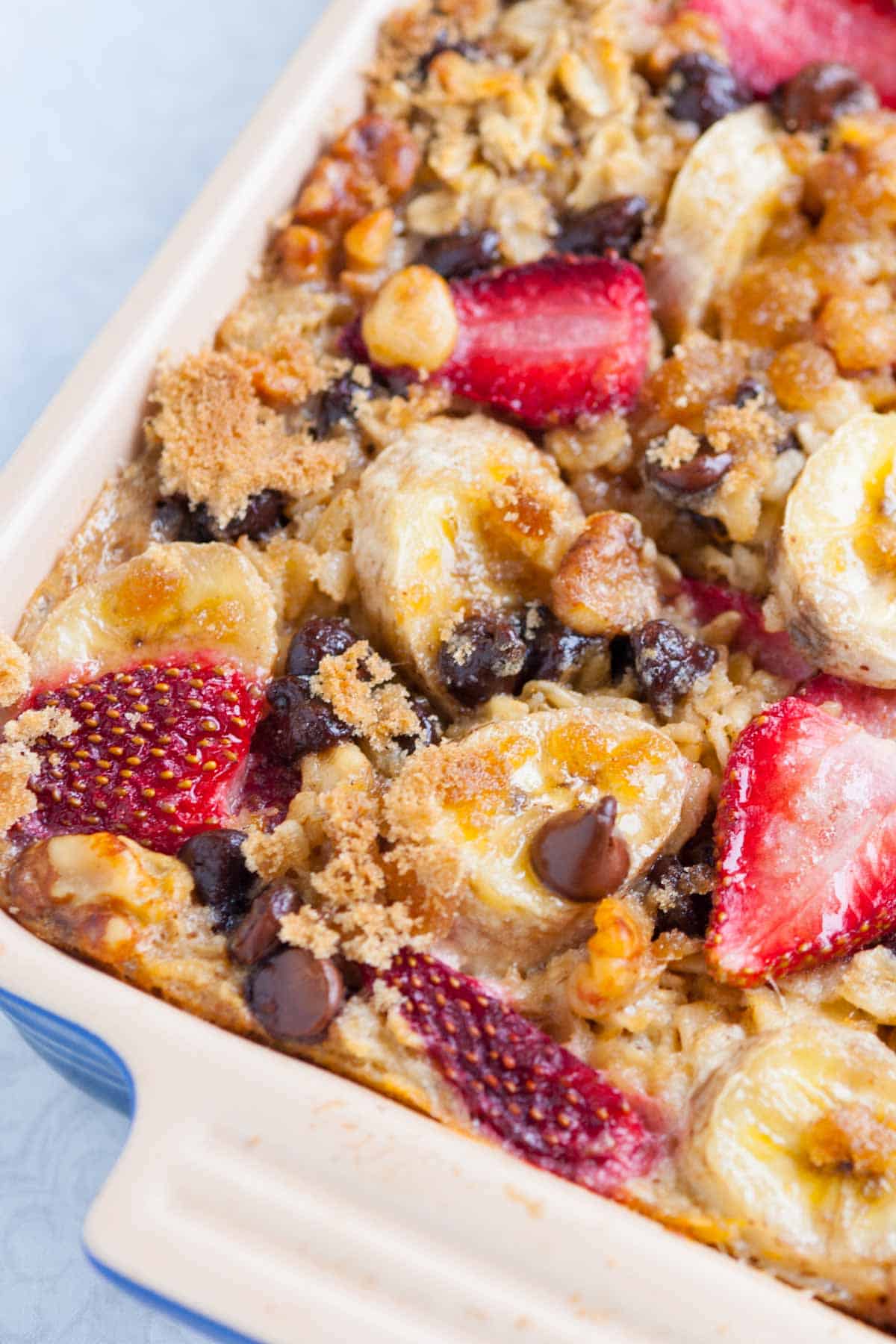 Baked oatmeal with strawberries, banana and chocolate