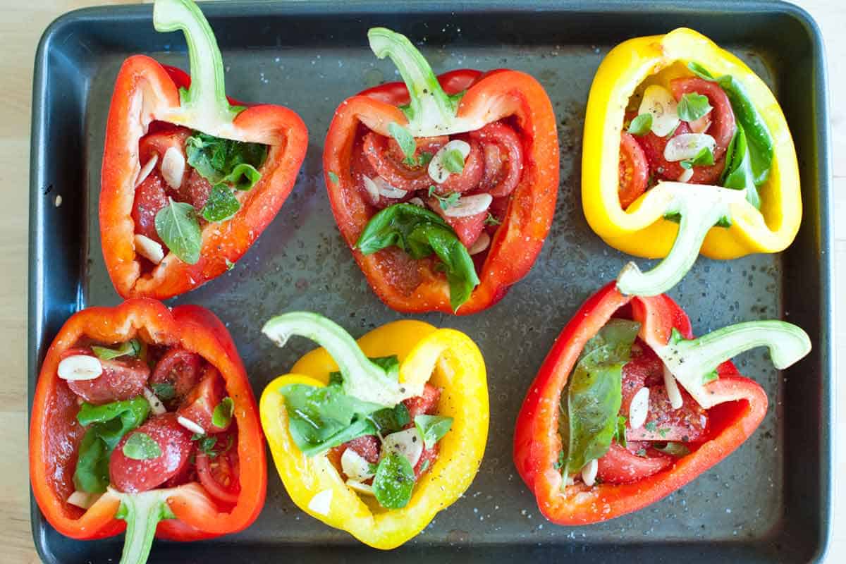 How to Make Tomato Basil Stuffed Bell Peppers Tomato Basil Stuffed Peppers: Filled pepper halves ready to bake
