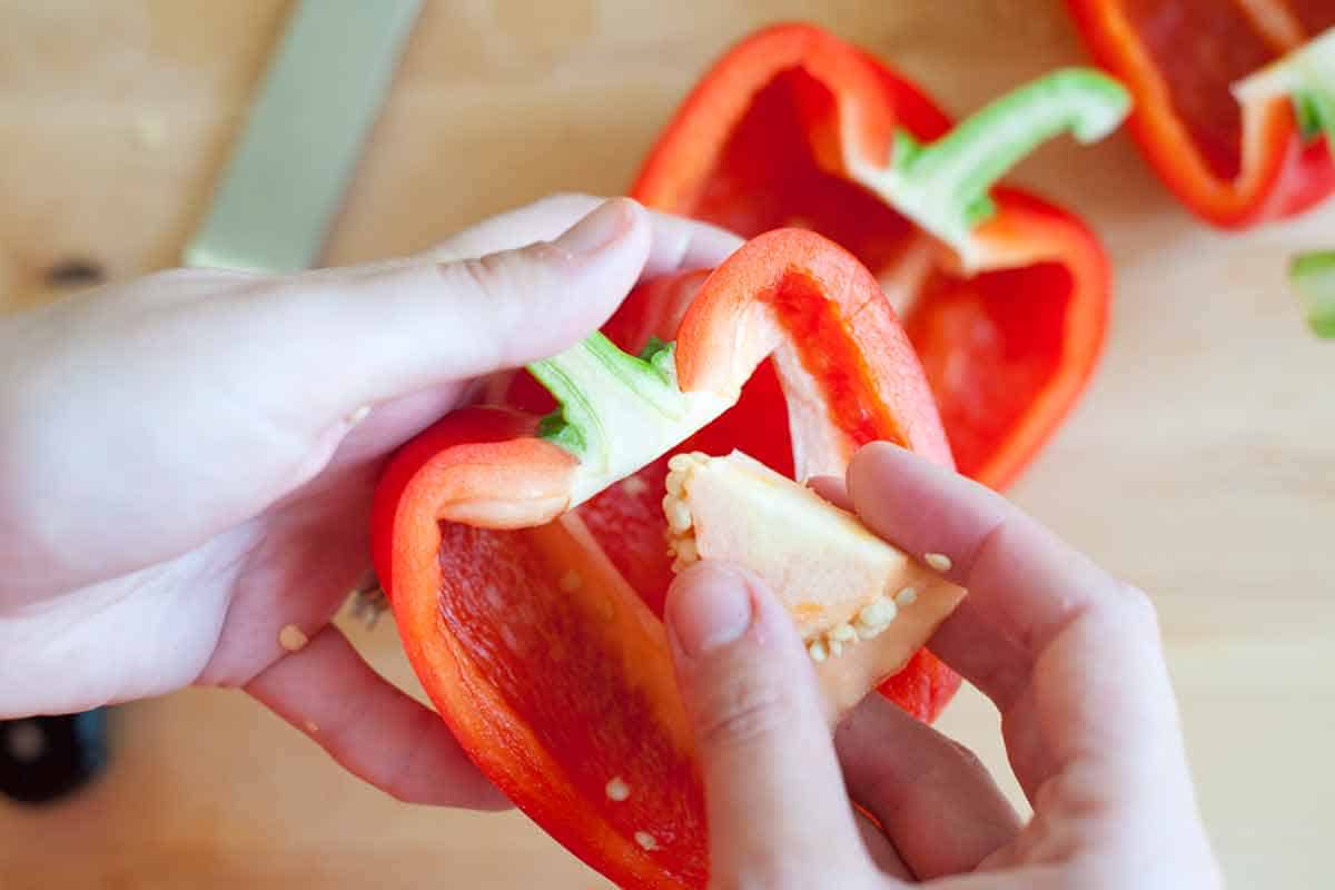How to Make Tomato Basil Stuffed Bell Peppers Remove the seeds and membrane.