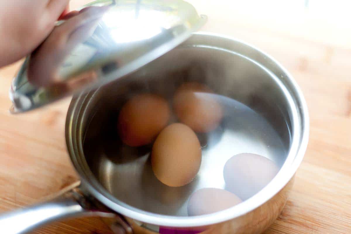 How to Cook Hard Boiled Eggs -- After boiling for 30 seconds, I move the pan off of the heat, and then set a timer for 10 to 12 minutes (depending on how large my eggs are).
