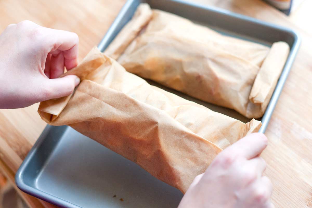 Easy Baked Fish in Parchment with Orange and Olives Folding up the packets