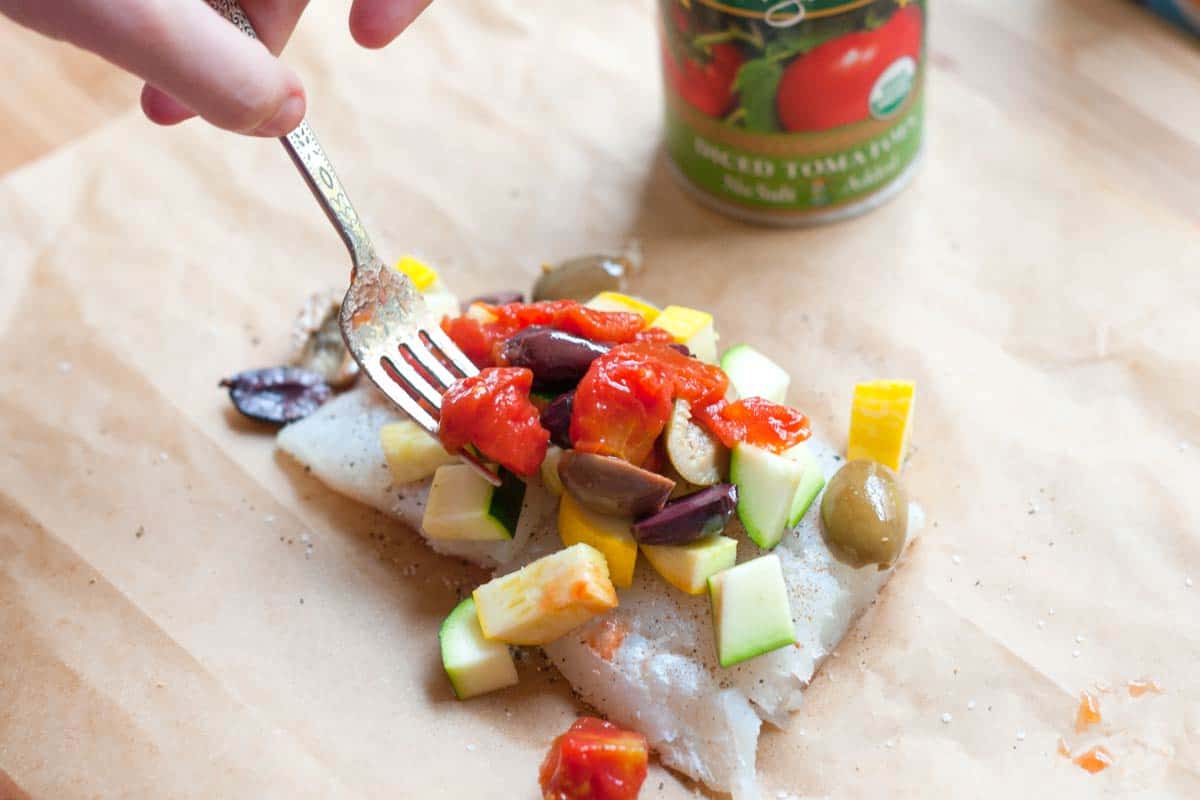 Easy Baked Fish in Parchment with Orange and Olives Adding the vegetables