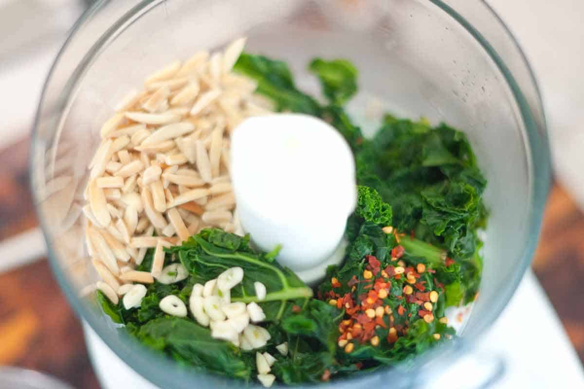 How to Make Kale and Almond Pesto Pasta Adding to a processor