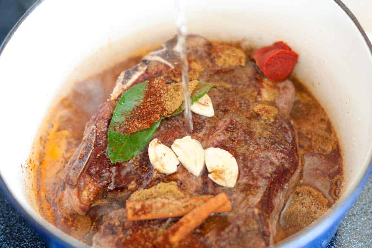 How to Make Irresistible Shredded Beef Tacos How to Make Shredded Beef Tacos: Cooking the beef with spices, garlic, and tomato paste