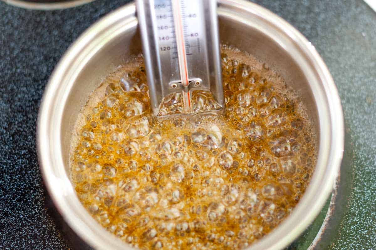 Making caramel sauce: Sugar bubbling in a saucepan