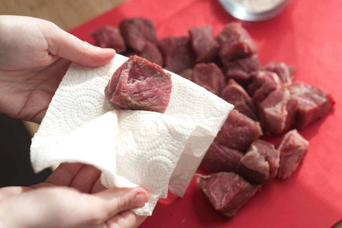 Patting stew meat dry