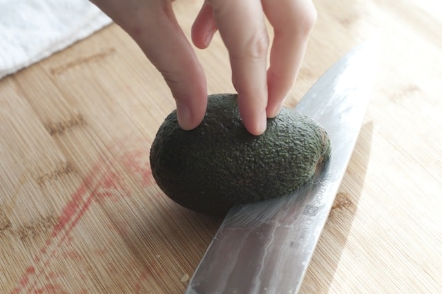 Cutting an avocado in half