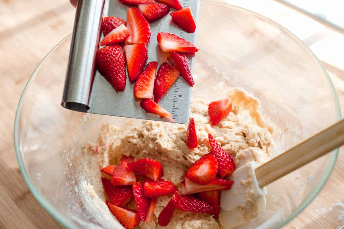 Adding the strawberries to the muffin batter