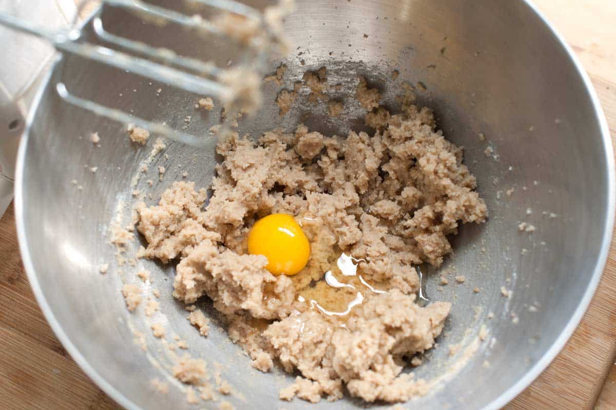 Once the butter, both sugars and vanilla are light and fluffy, it’s time to add egg.