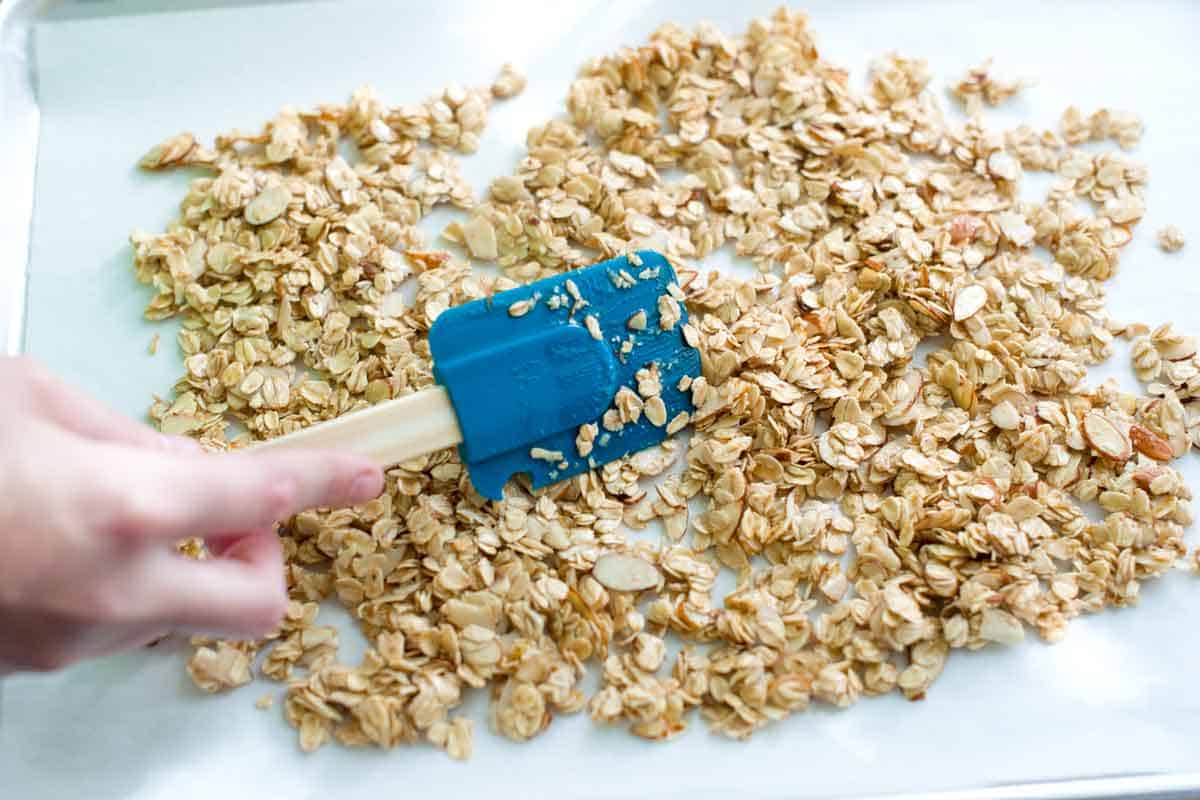 Spreading oat mixture into one layer for granola