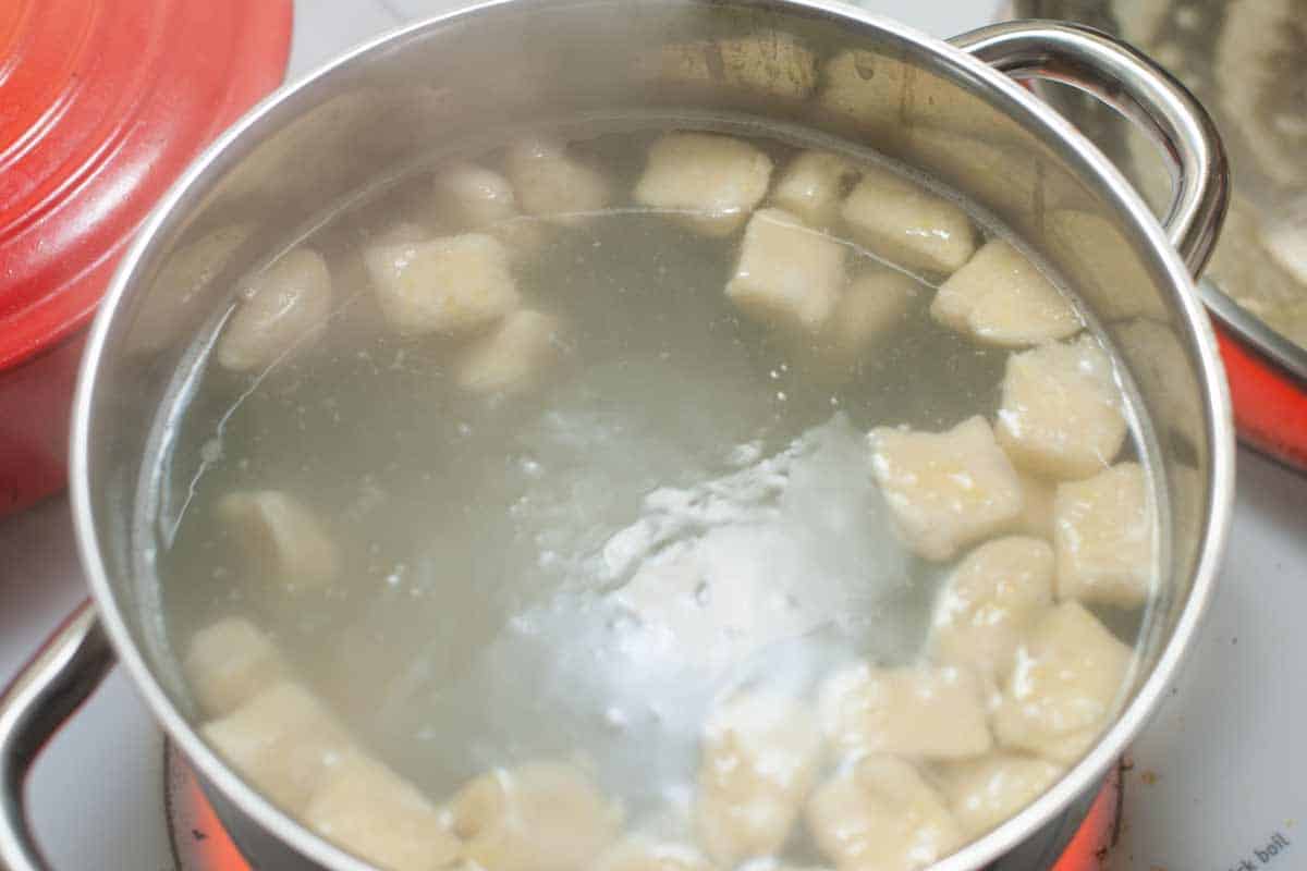 Gnocchi floating to the top of simmering water