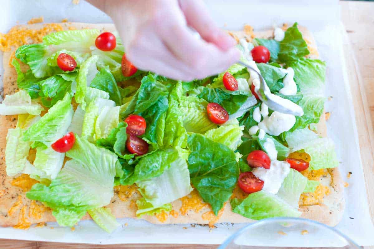 Simple Caesar Salad Pizza Recipe Adding the salad