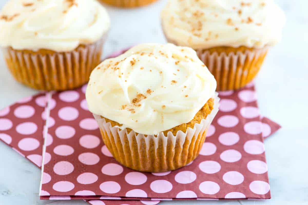 How to make tender and moist pumpkin cupcakes with a simple cream cheese frosting. These perfectly spiced pumpkin cupcakes are hard to beat. 