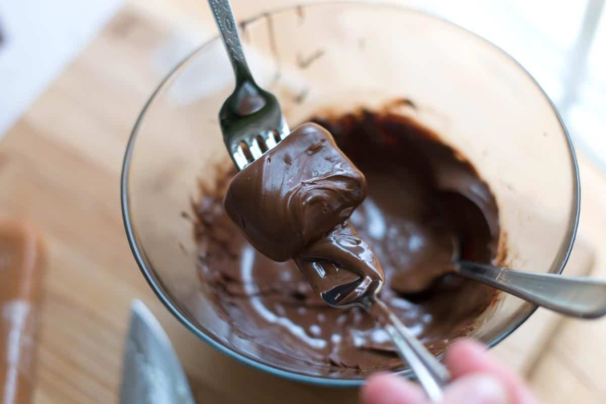 Chocolate Covered Caramels Recipe Dunking Caramels into Chocolate for Chocolate Covered Caramels
