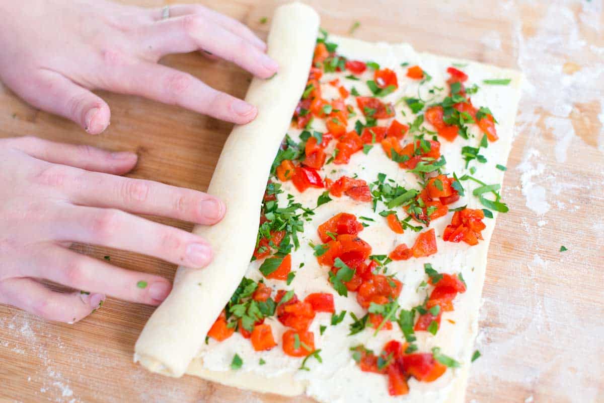 Cheesy Roasted Pepper Pinwheels Recipe How to Make Cheese Pinwheels: Rolling up the puff pastry.