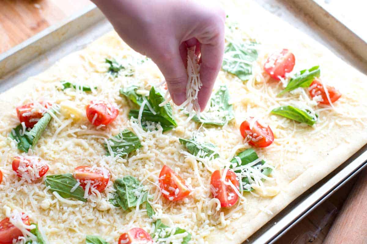 Quick Tomato Basil Pizza Recipe with Sea Salt Adding the cheese