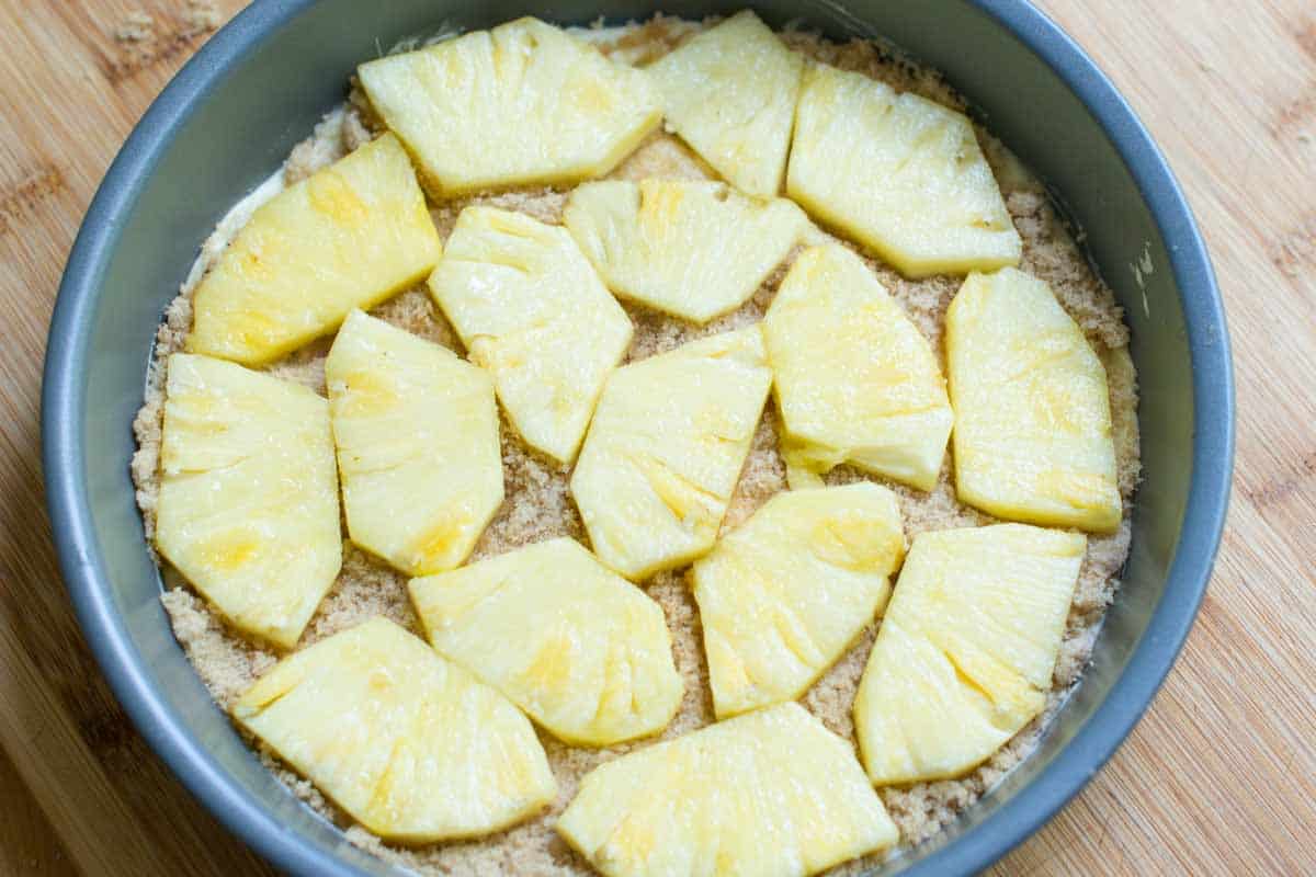Use Fresh Pineapple for the Best Upside Down Pineapple Cake How to Make Pineapple Upside Down Cake - A layer of fresh pineapple on the bottom of the cake pan.