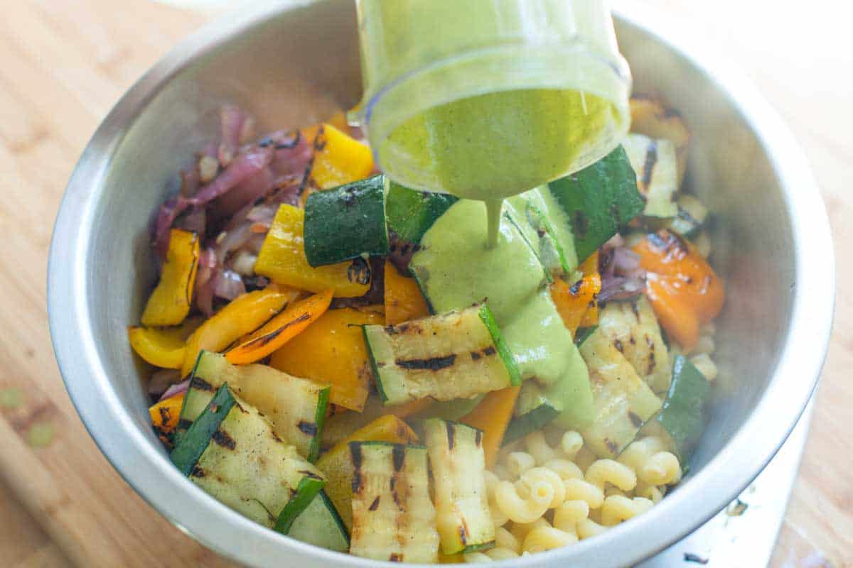 Lemon Basil Pasta Salad Recipe with Veggies Adding the dressing