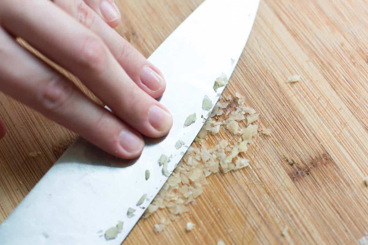 How to Make Basil Pesto Turn the garlic into a paste.