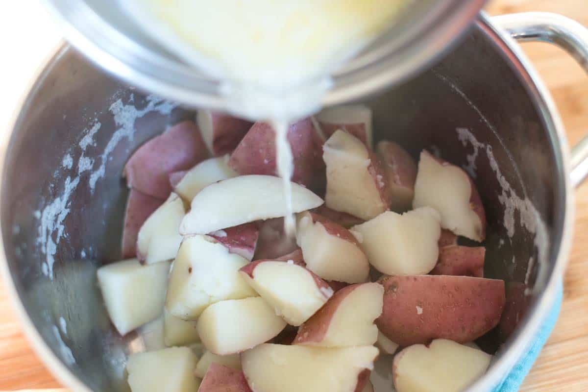 How to Make Mashed Potatoes: Adding butter, milk (or stock) to potatoes