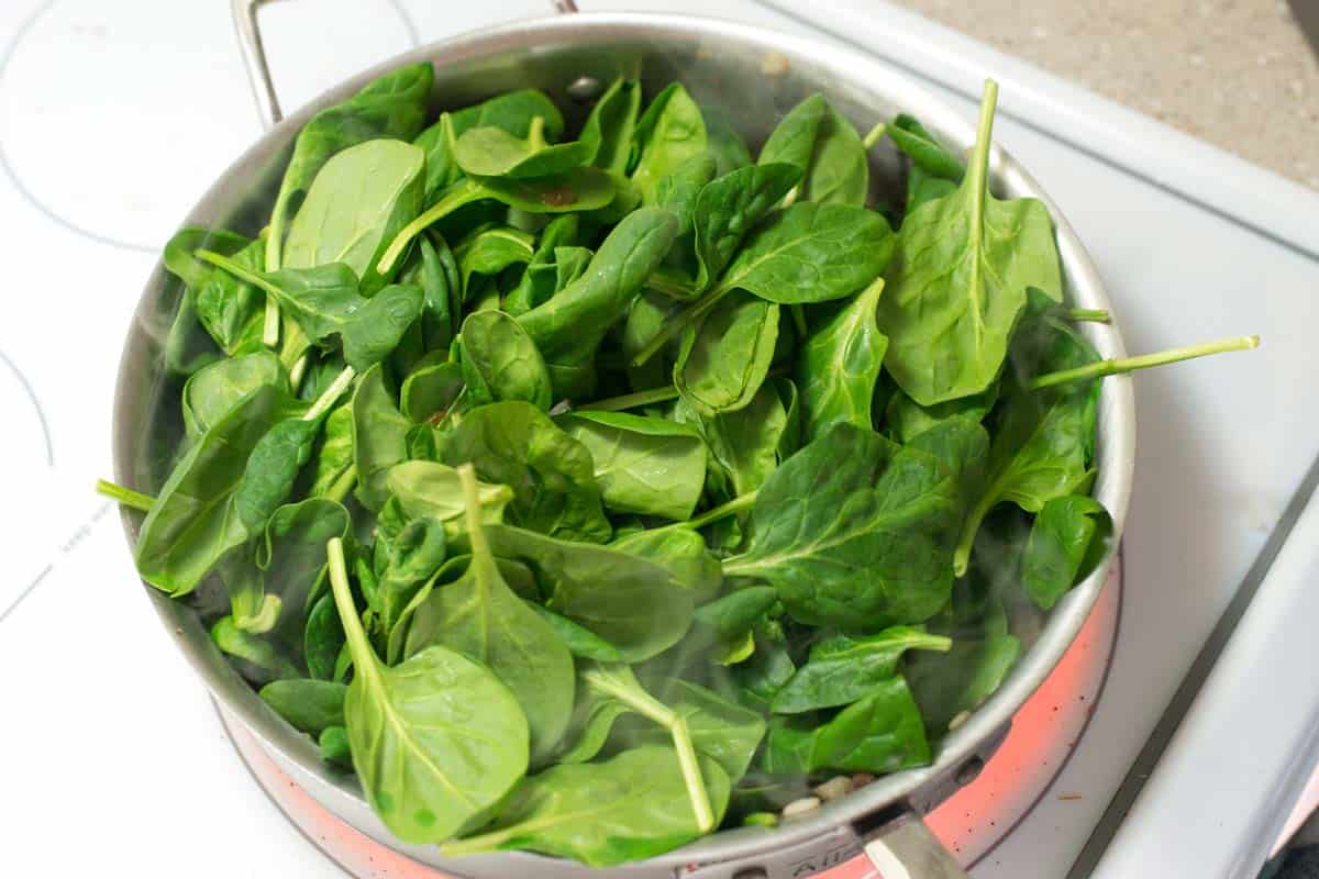 Cooking the filling -- mushrooms, onions and spinach