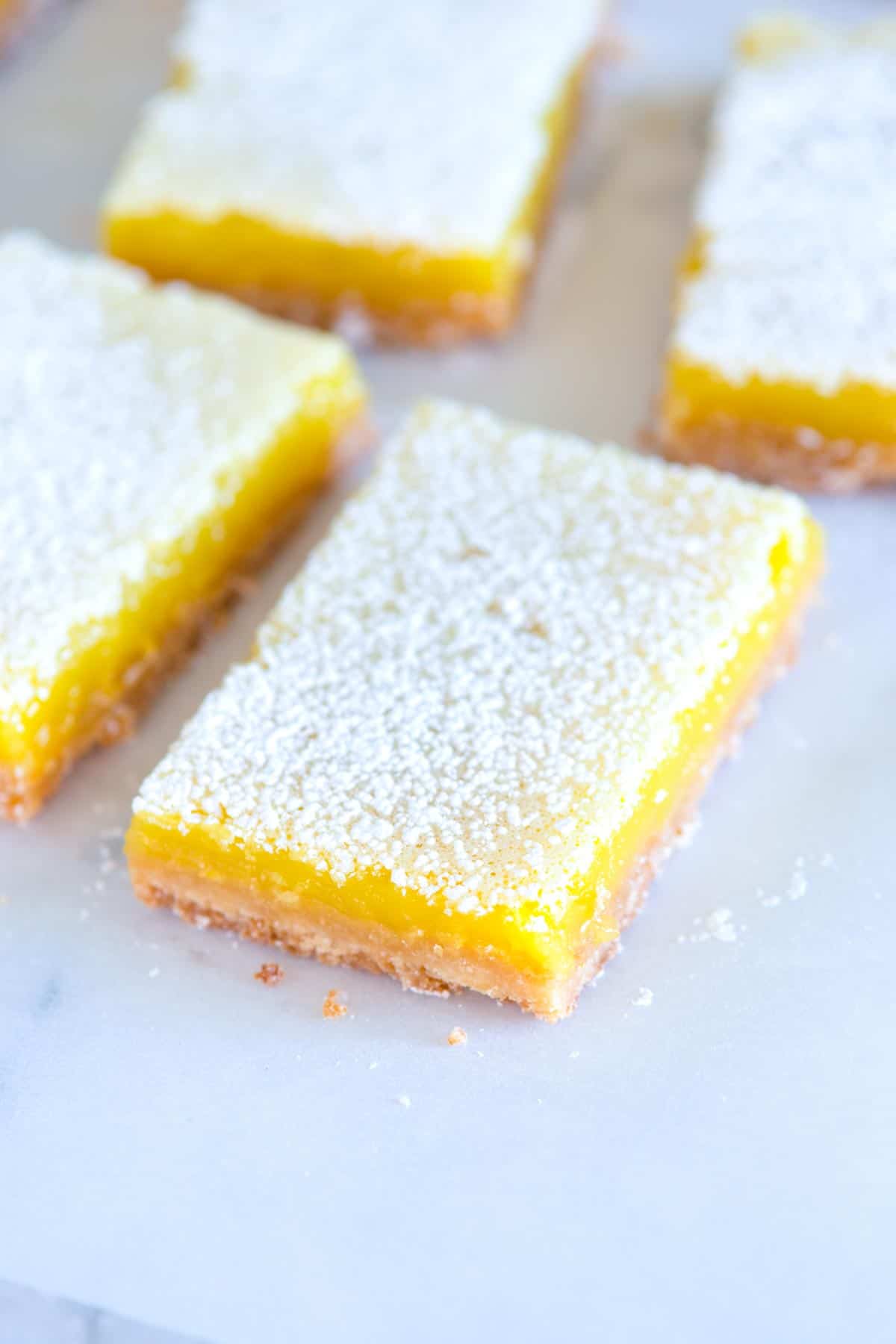 My favorite lemon bars recipe! These classic lemon bars have a crisp shortbread crust and a creamy delicious tart lemon topping. These bars need to be made in your kitchen, ASAP.