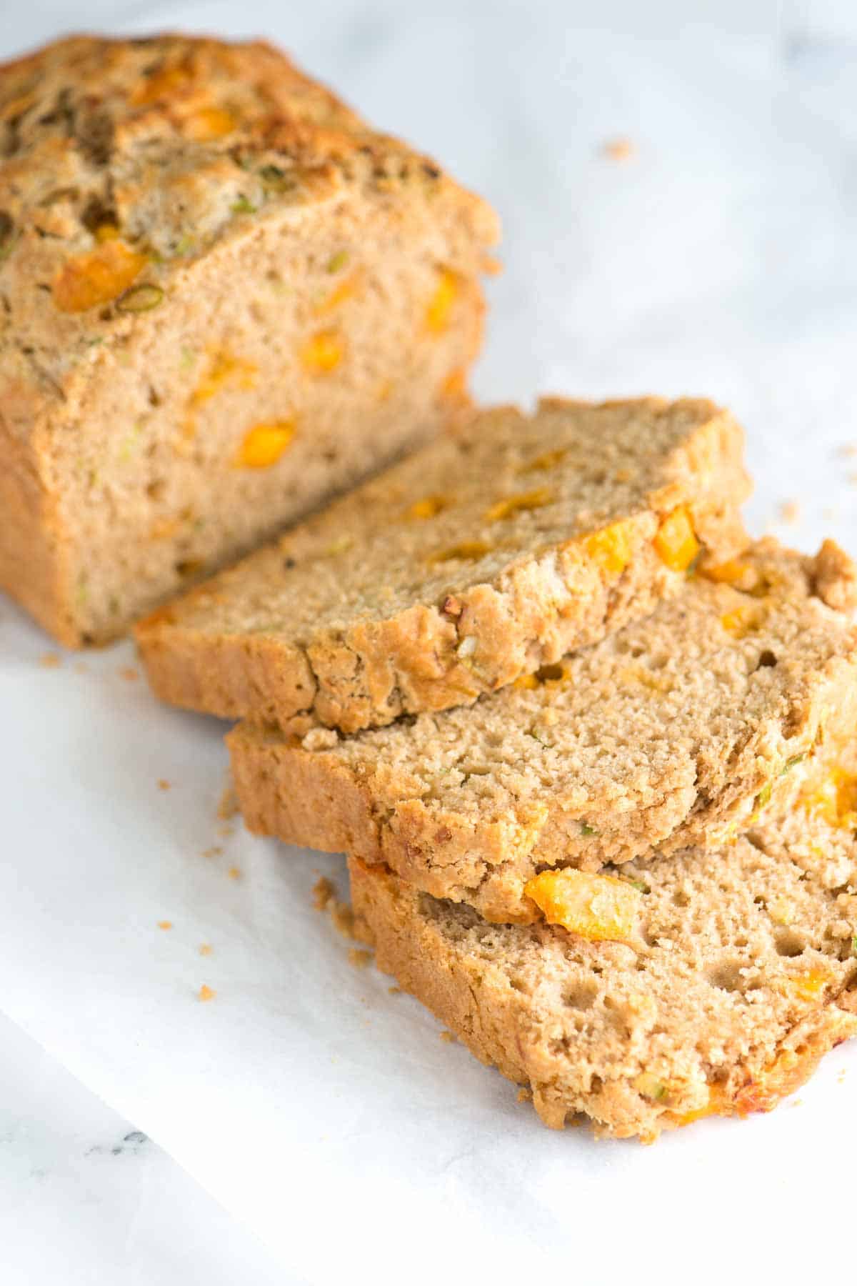 How to Make Cheddar Beer Bread with Scallions Sliced beer bread made with stout beer and cheddar cheese