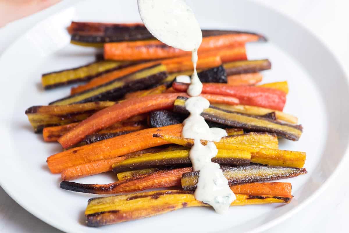 Plate of honey roasted carrots with tahini sauce