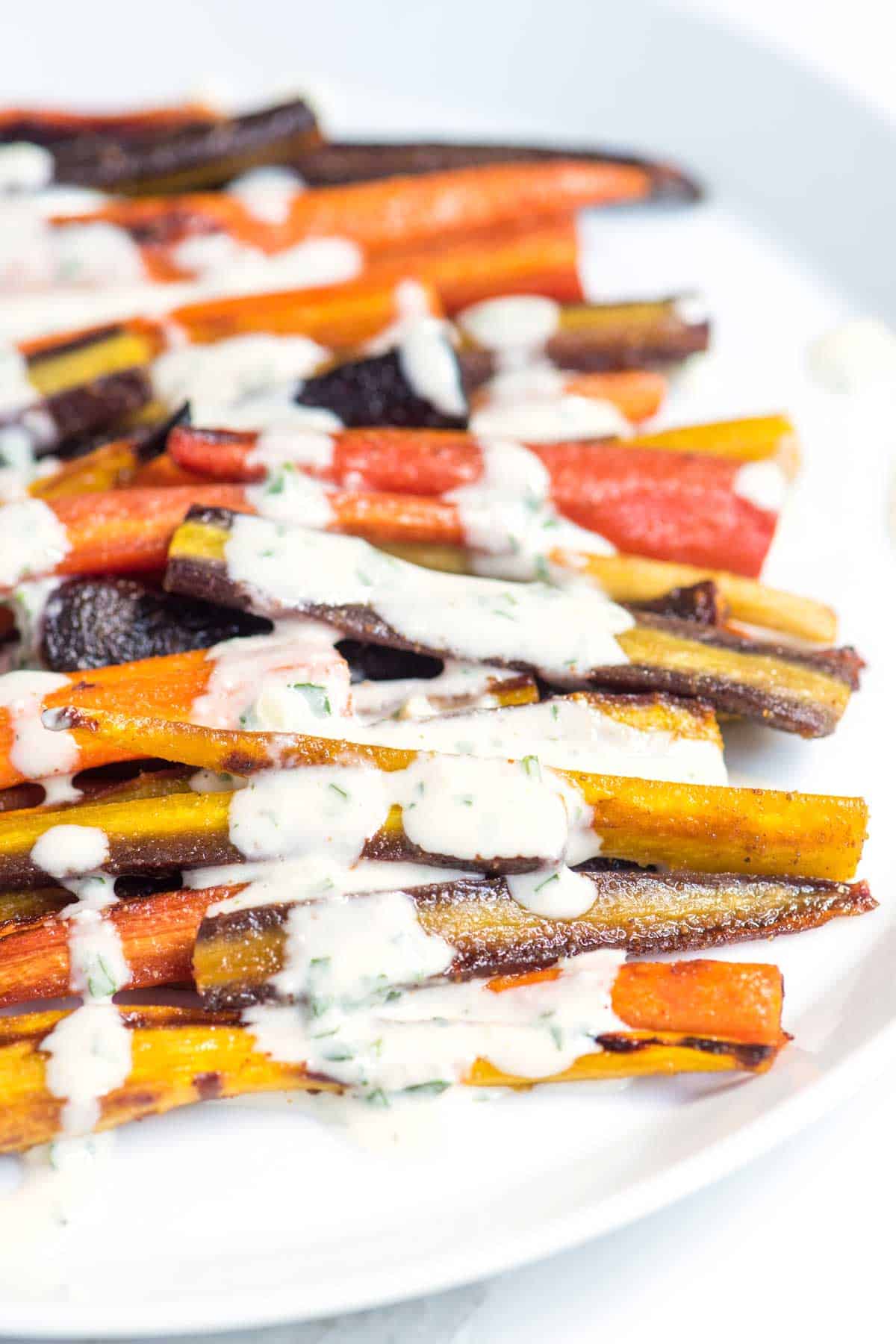 Honey roasted carrots with creamy tahini sauce - a delicious and healthy side dish.