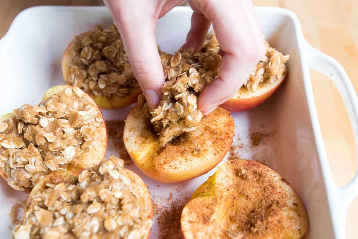 Adding the crisp topping to the apples