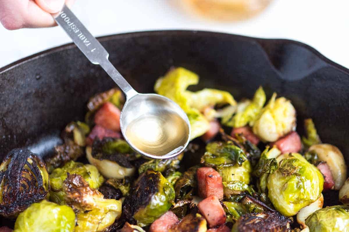How Make Roasted Brussels Sprouts: Add a pop of flavor to roasted Brussels spouts with apple cider vinegar just after roasting.