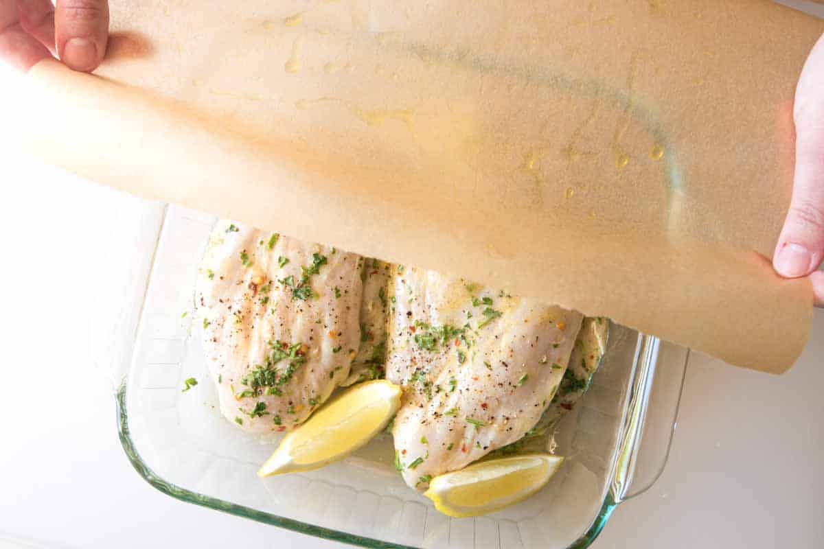 How to Make Lemon Baked Chicken Breasts: Loosely covering the chicken before baking.
