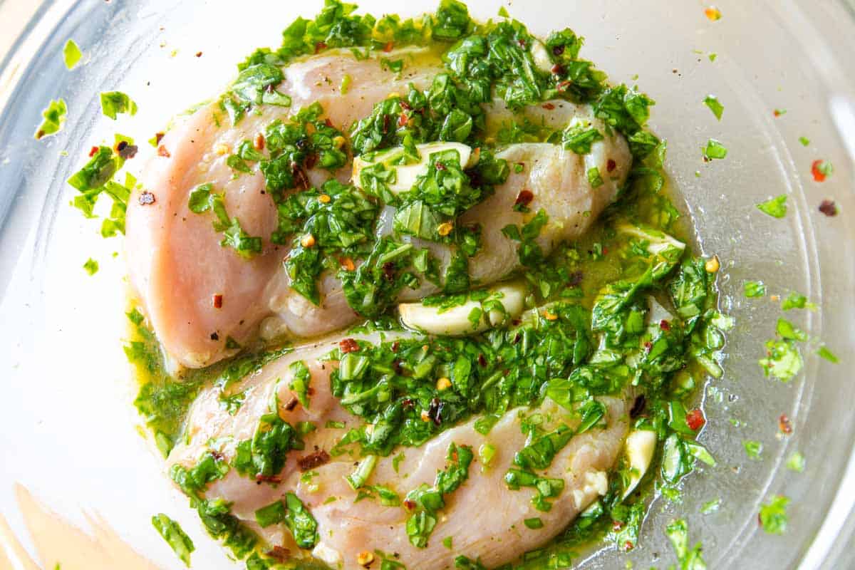 Garlic Basil Baked Chicken Breasts with Tomatoes How to Make Tomato Basil Baked Chicken Breasts: Marinating the chicken in basil vinaigrette