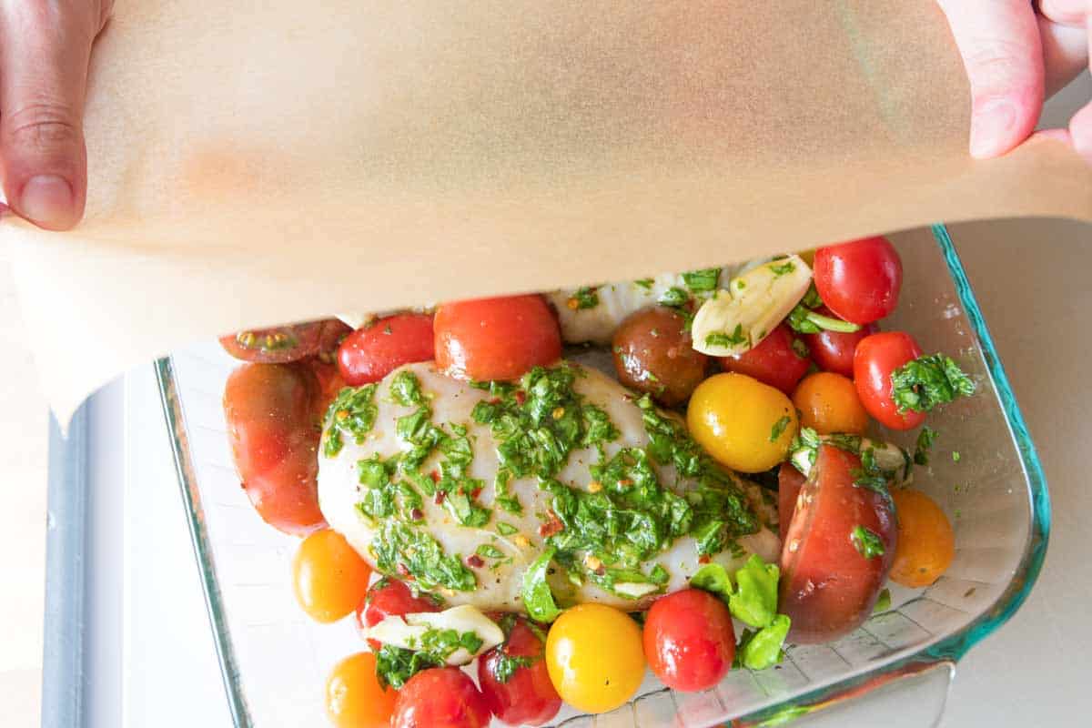Garlic Basil Baked Chicken Breasts with Tomatoes Tomato Basil Baked Chicken Breasts: Cover with parchment paper before baking.