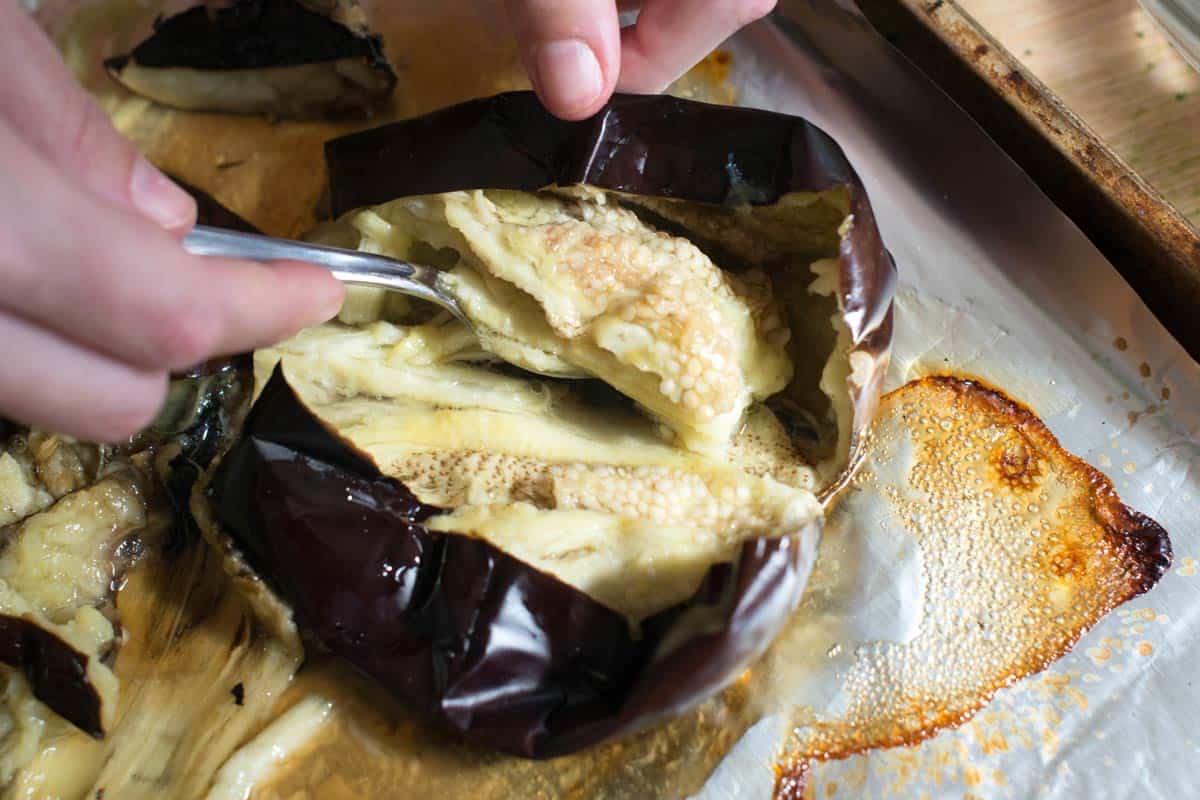 Removing seeds from charred and roasted eggplant