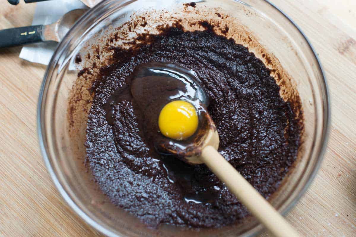 Adding the eggs to the brownie batter