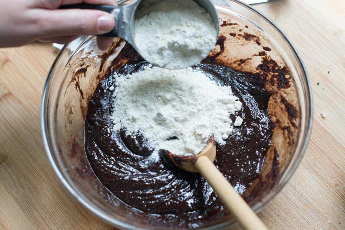 Adding 1/2 cup of flour to make extra fudgy brownies.