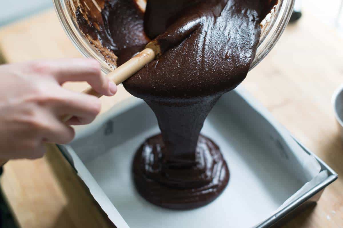 Pouring the brownie batter into the baking pan