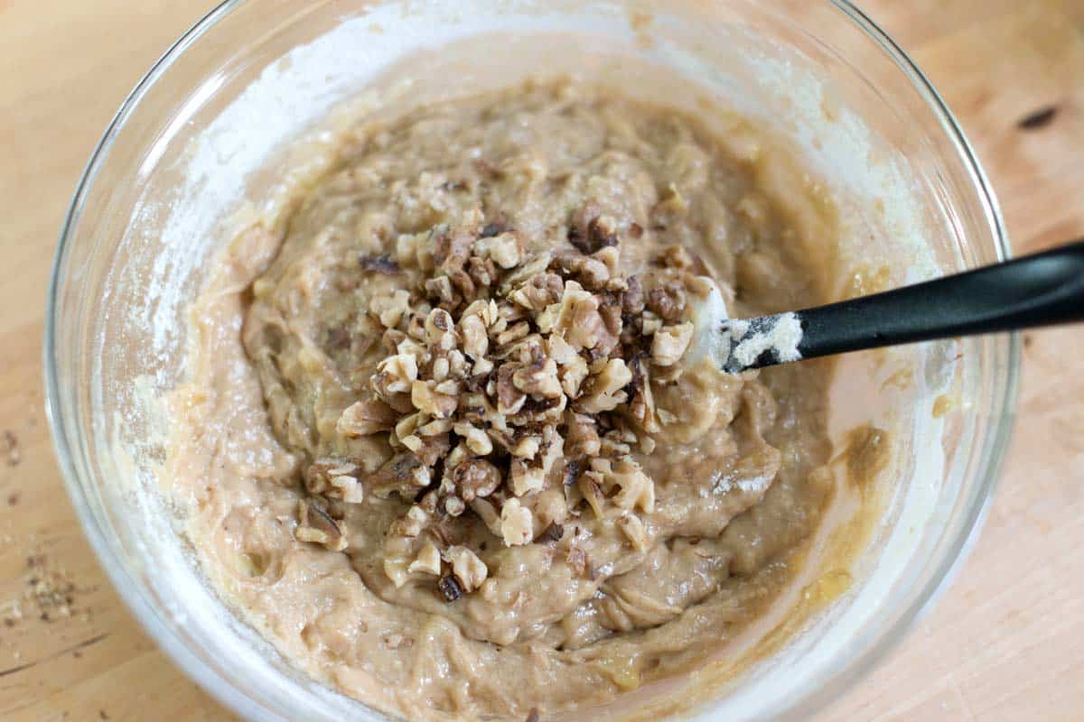 Adding walnuts to banana bread batter