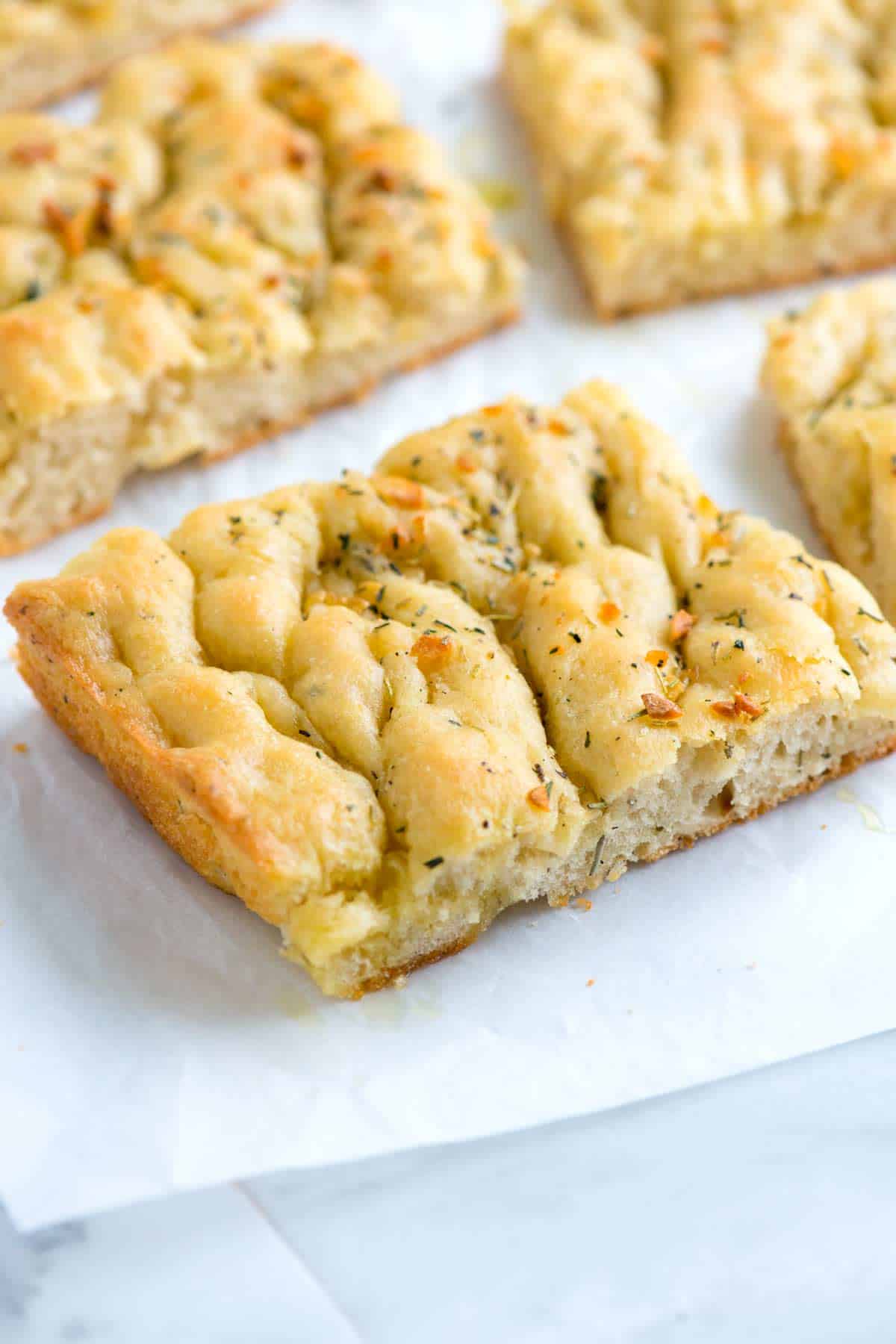 Freshly baked homemade focaccia bread with garlic and rosemary