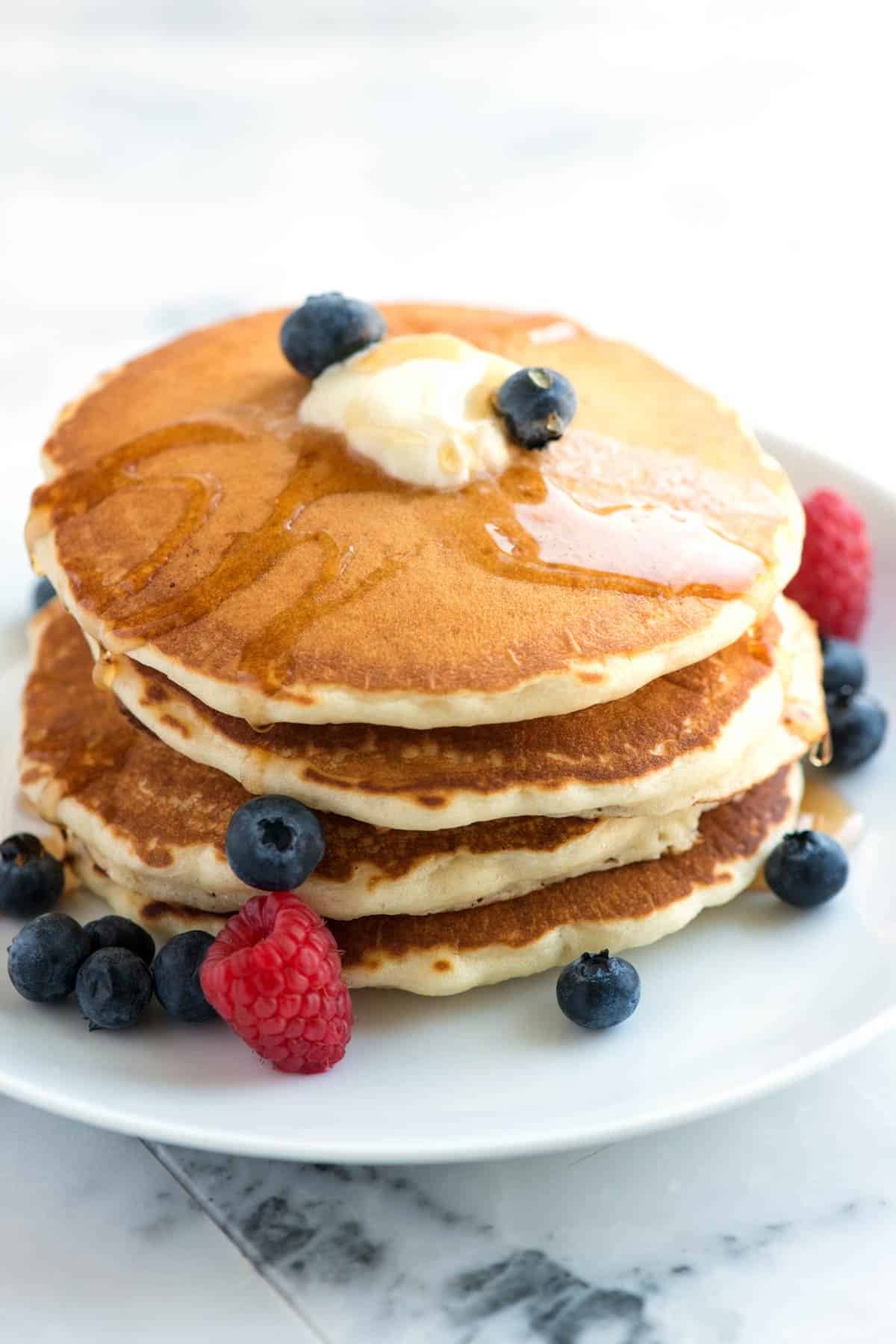 Stack of homemade pancakes from scratch with berries