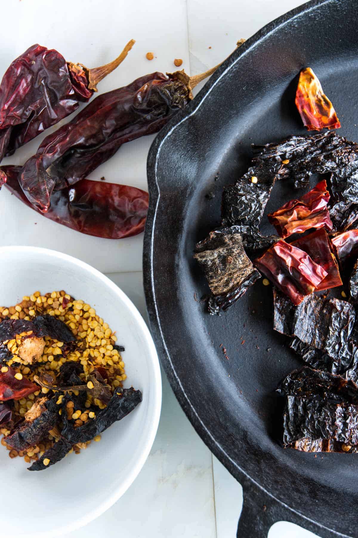 Toasting dried chilis in a pan