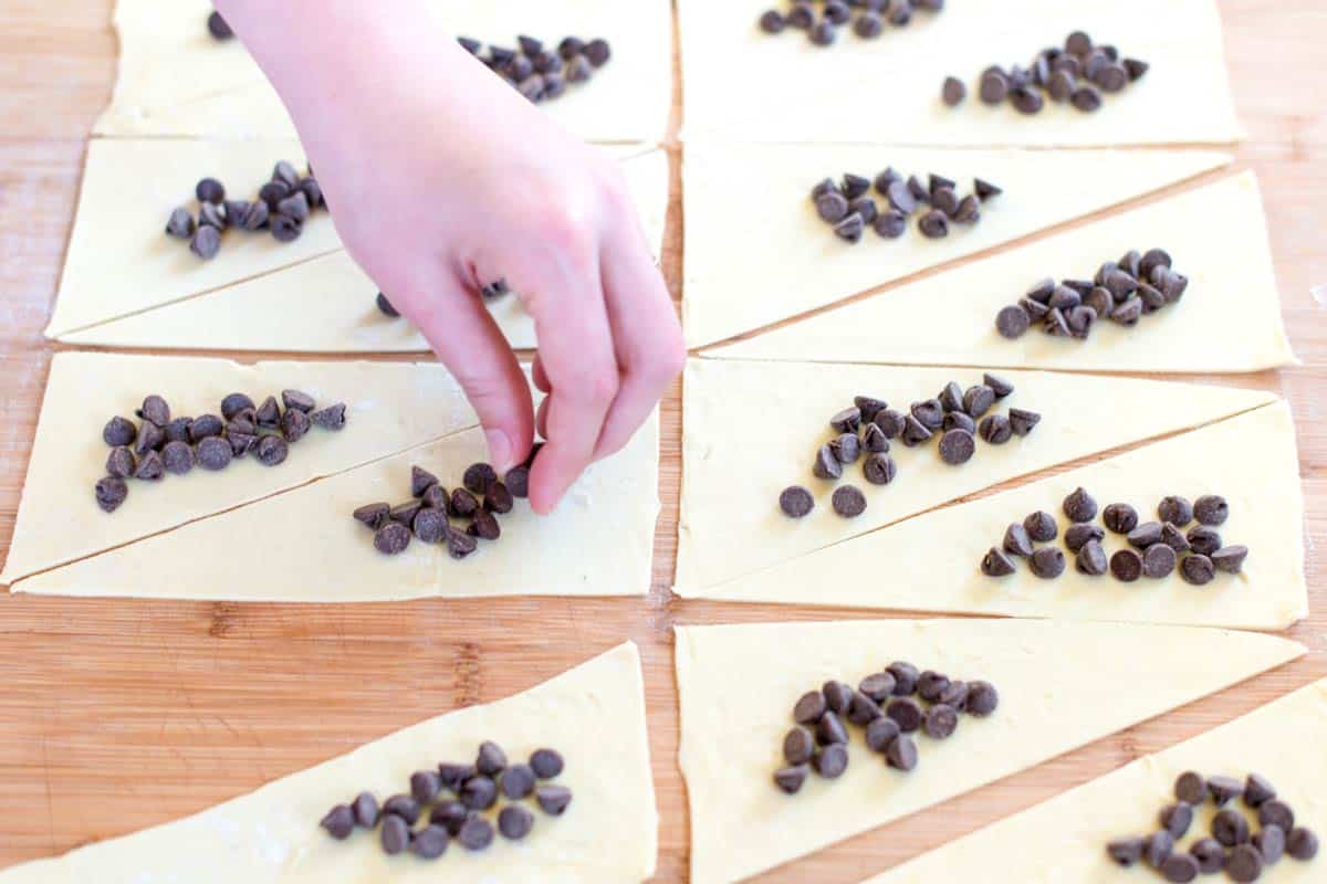 Adding chocolate to the dough for chocolate croissants