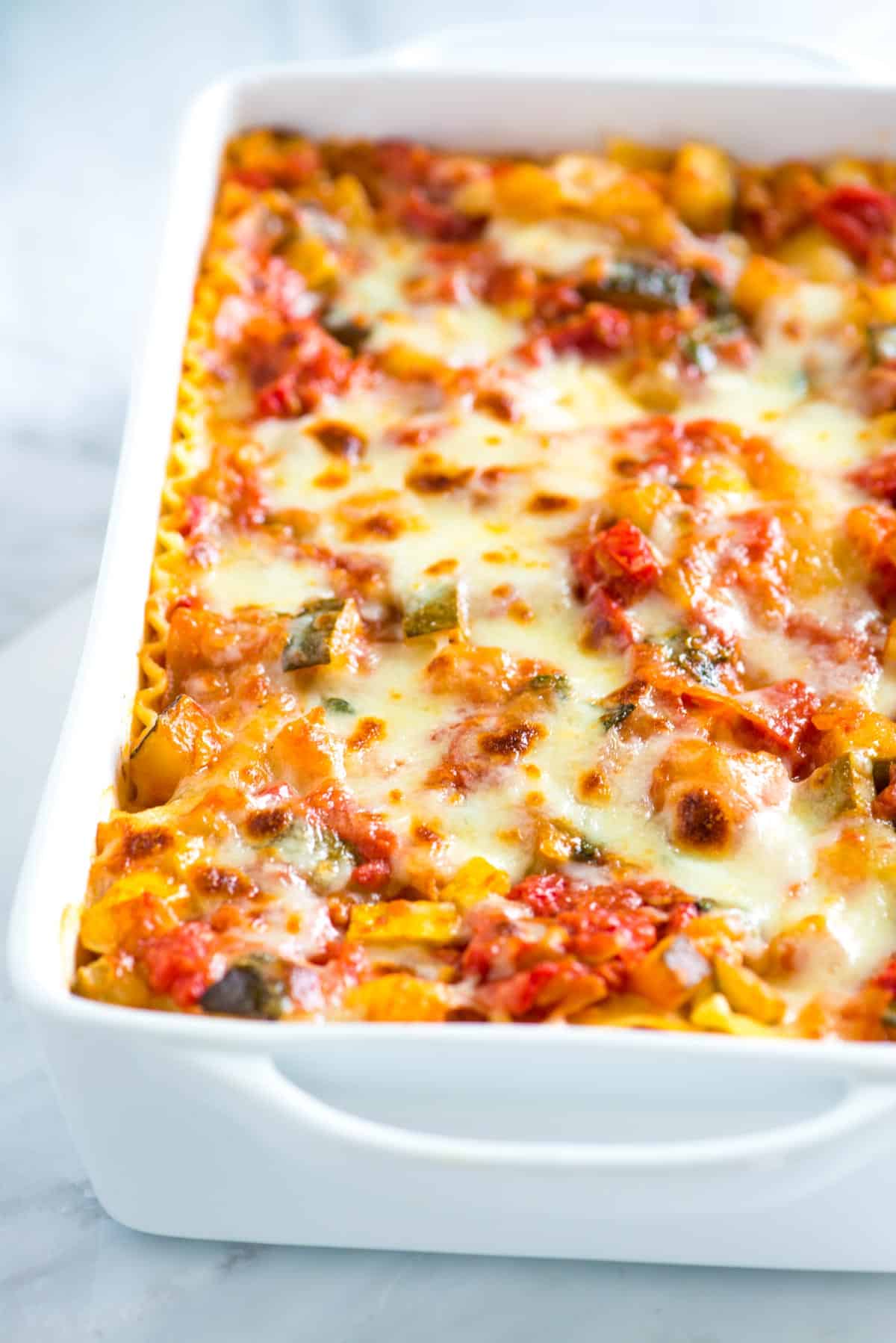This vegetable lasagna is a reader favorite! Tender vegetables, a light tomato sauce, and lots of cheese make this the best vegetable lasagna recipe, ever.