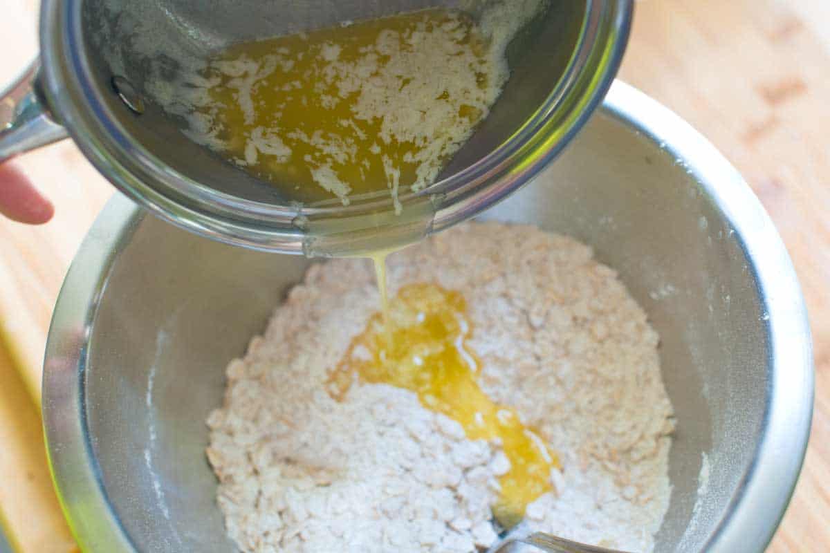 Making the apple crisp topping with melted butter