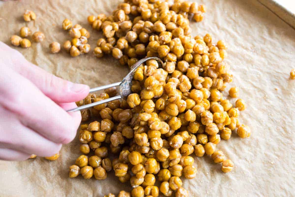 Three Secrets for the Crispiest, Crunchiest Chickpeas How to Make Honey Roasted Chickpeas: Tossing with honey, cinnamon, and salt
