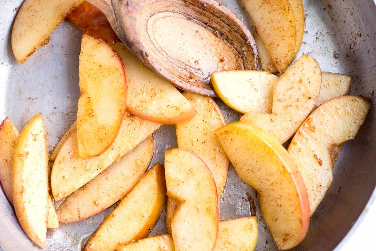 Cooked spices apples with cinnamon and cardamom.